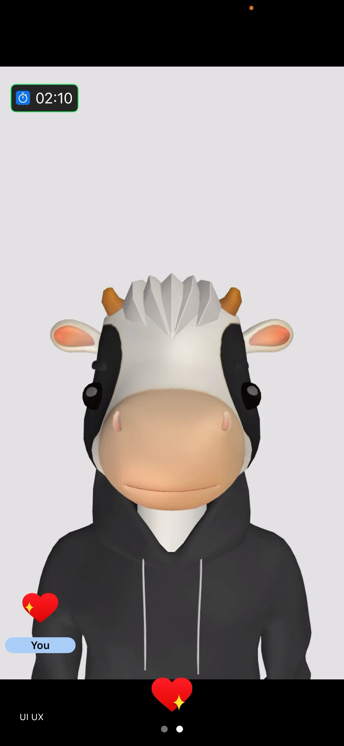 A cartoon cow character wearing a hoodie is displayed on the screen.